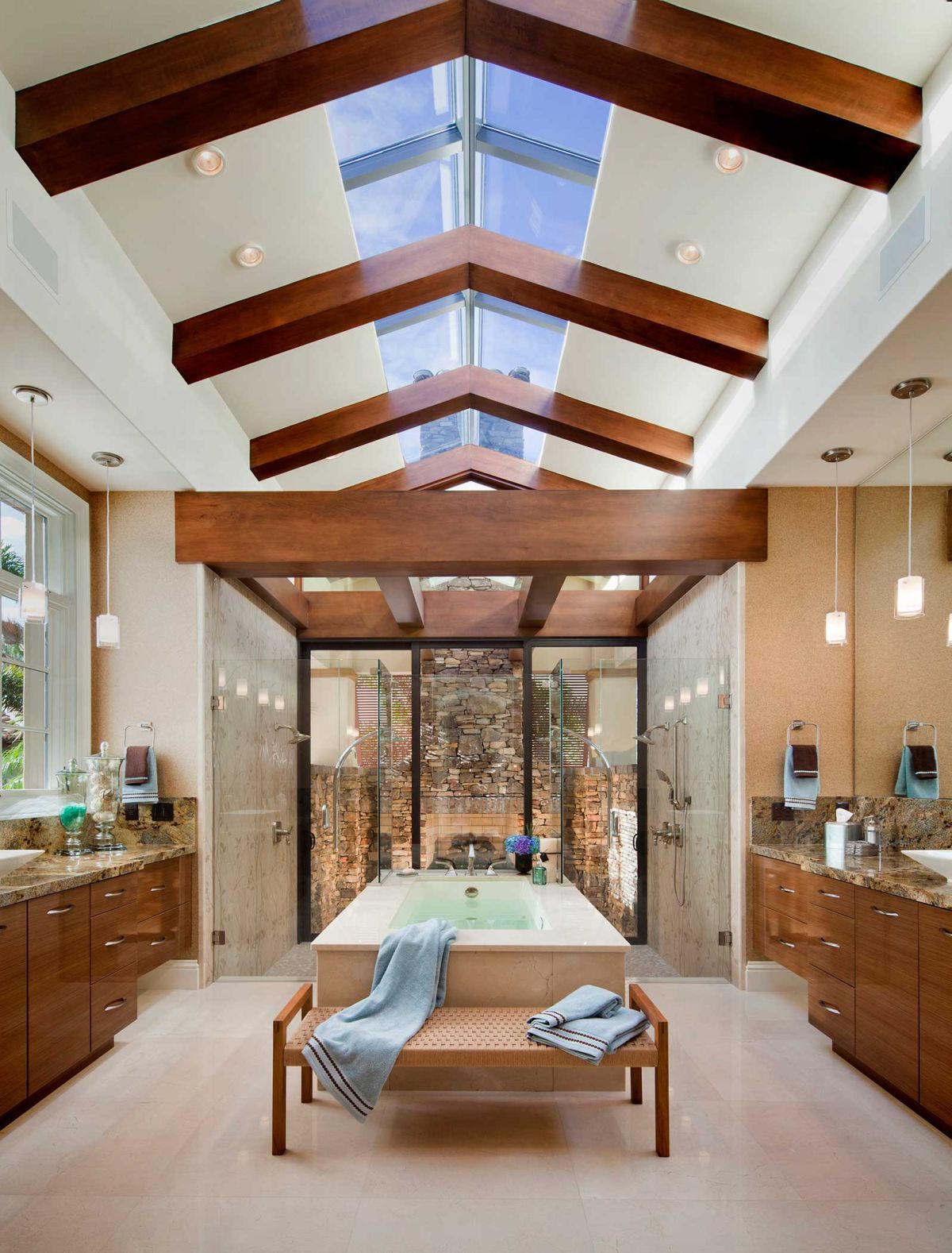 Master bathroom with vaulted ceiling and skylight