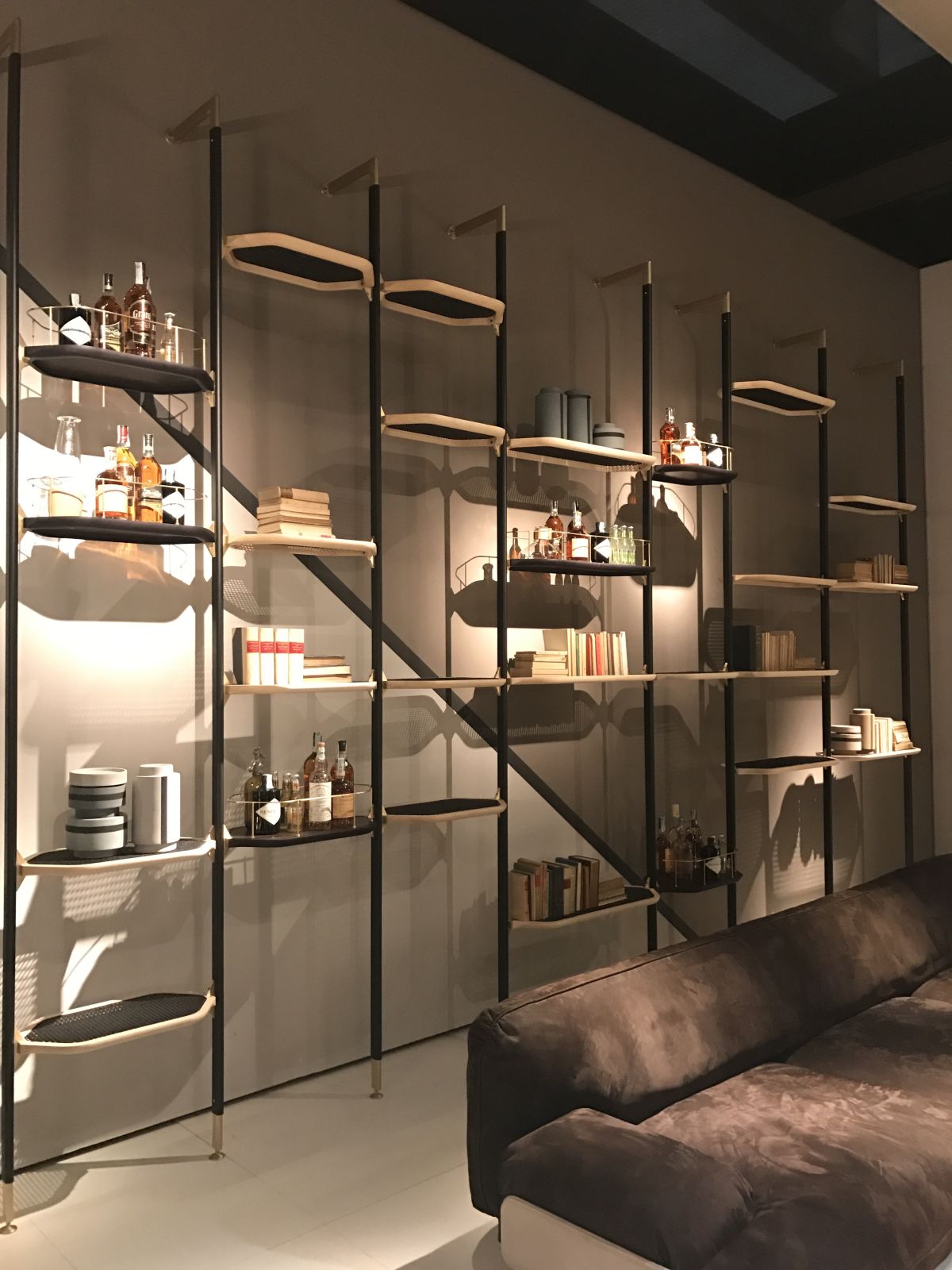 Display multiple shelves at various different heights to create a unique and asymmetrical installation